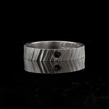Men's wedding ring with black diamond...
