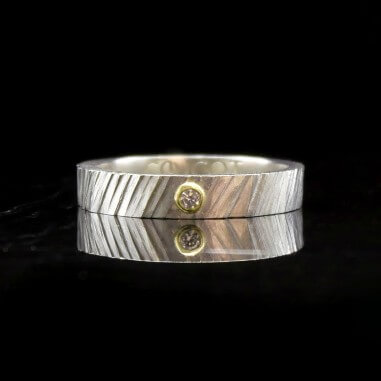 Two-tone wedding band with diamond -...