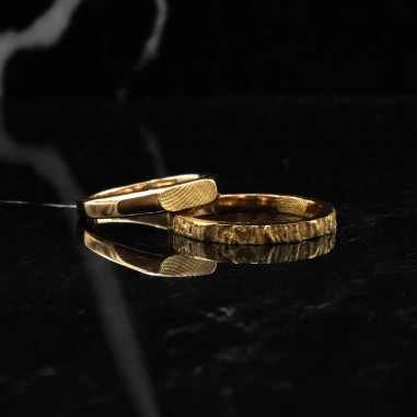 Wedding ring in 18K yellow gold...
